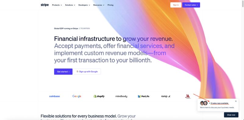 The Stripe homepage chat widget in the bottom right corner, showing a green status dot and a note that 6 sales reps are available